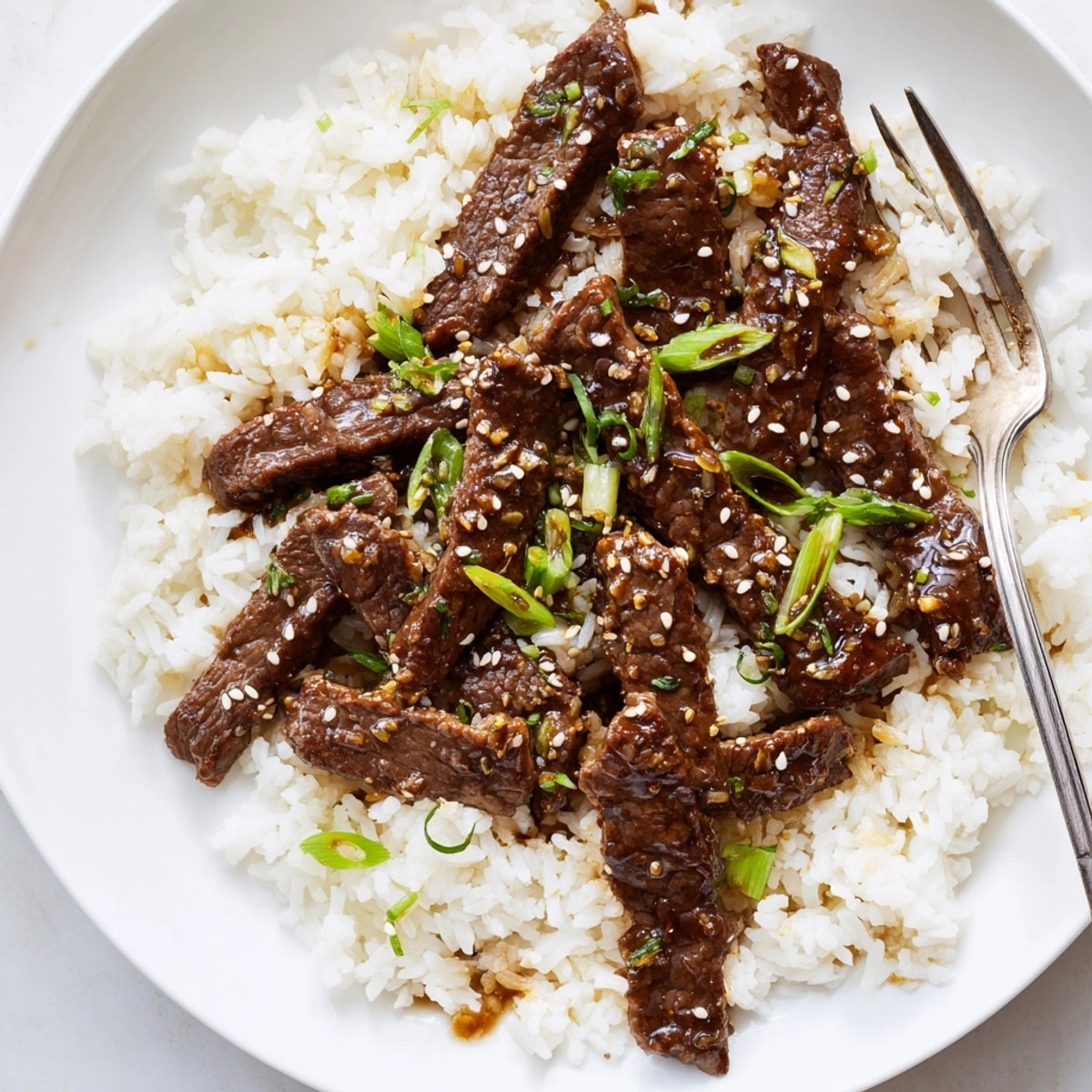 Savory-sweet Mongolian Beef Stir Fry with tender beef strips, ready to enjoy.
