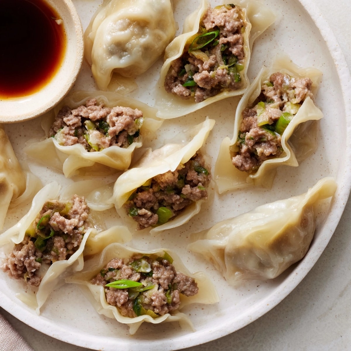 Steaming Beef Shiitake Dumplings reveal a juicy filling, perfect for an Asian-inspired meal.