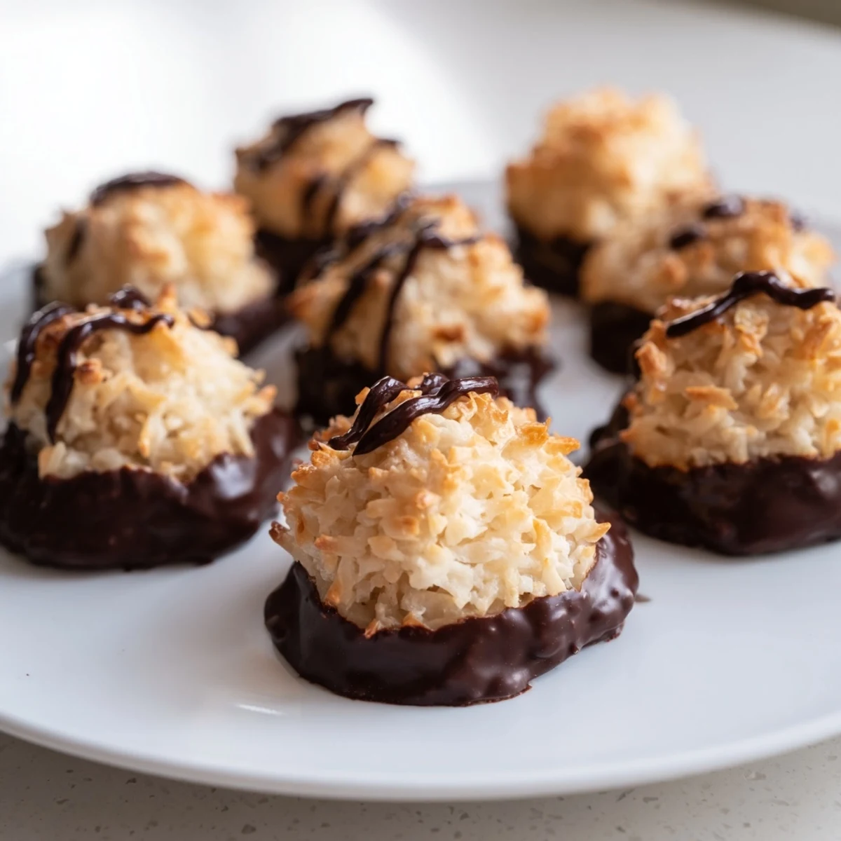 Freshly dipped chocolate covered coconut macaroons—delicious gluten-free cookies, a perfect American classic!