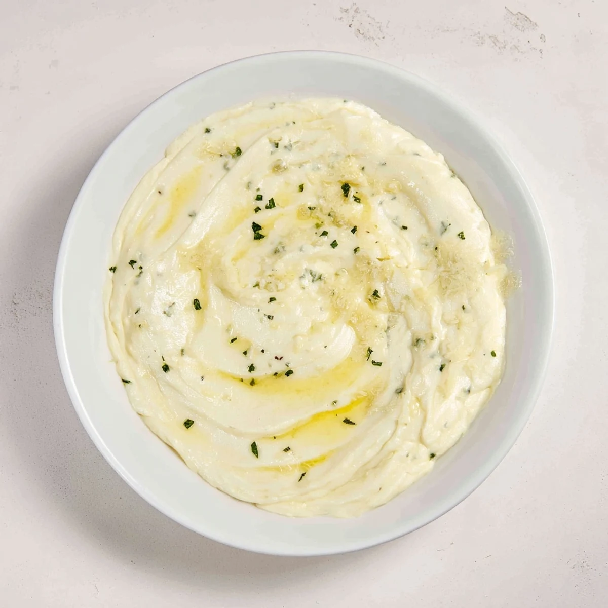 Ladleful of homemade creamy sauce, a luscious, smooth blend of butter and cream.