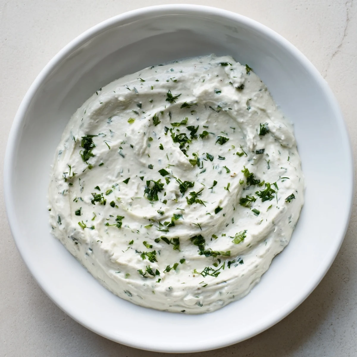 Creamy Herb Dip, a thick, vibrant green dip, served with crunchy carrot sticks and colorful bell peppers.