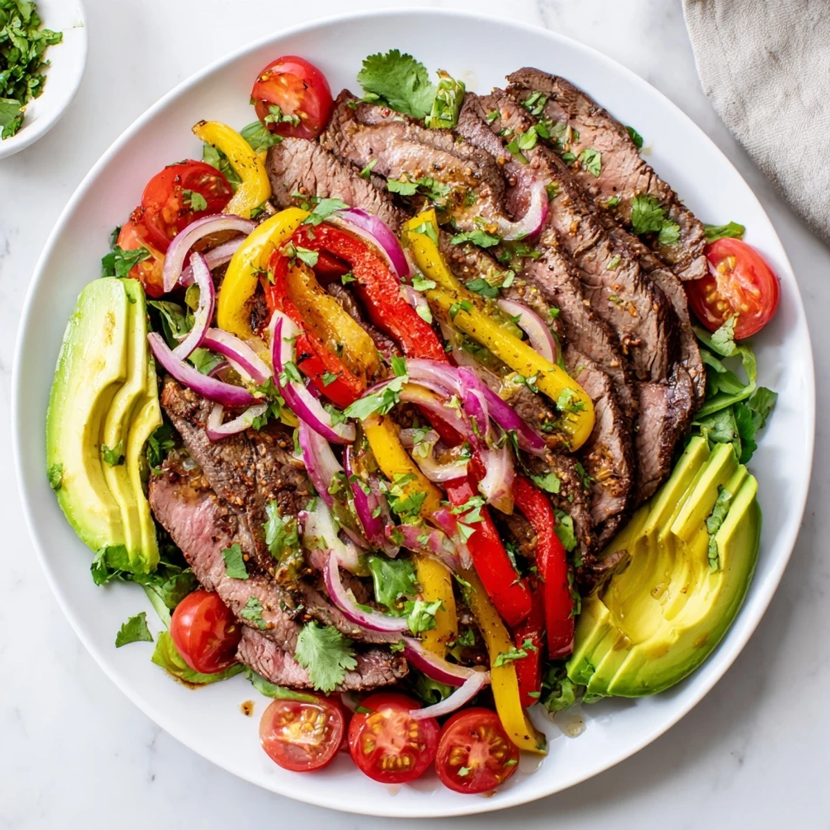Bright, flavorful beef fajita salad with a tangy lime dressing, perfect for a fresh and satisfying meal.