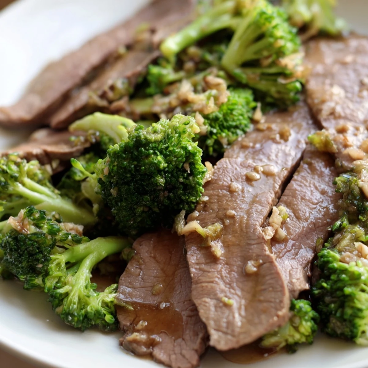 Steaming Beef and Broccoli Stir Fry with Oyster Sauce served alongside fluffy white rice, perfect for hungry diners.