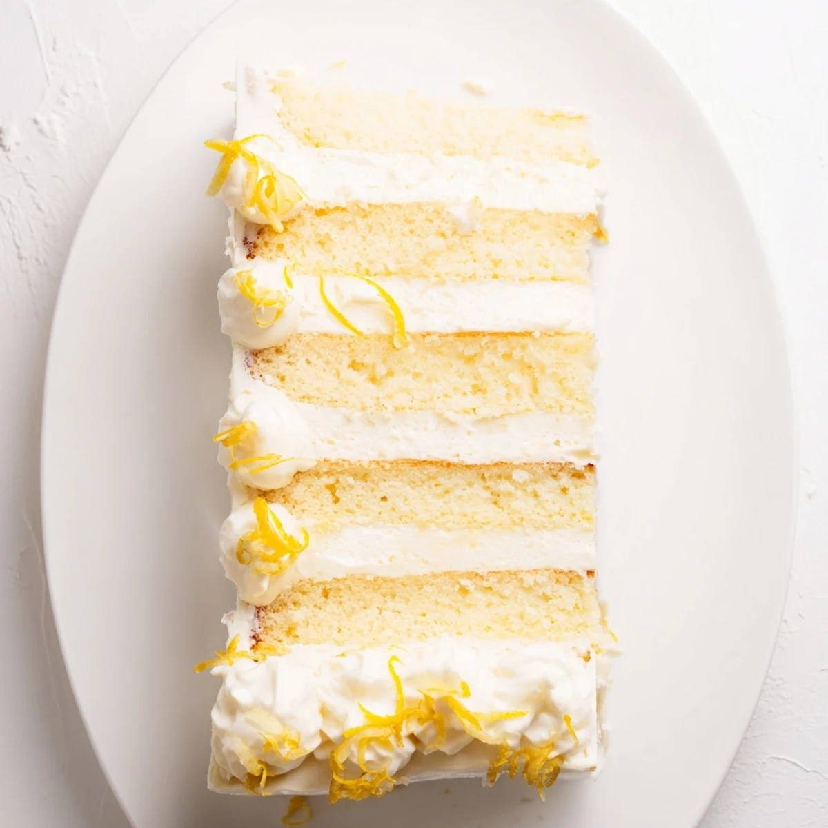 Freshly baked Limoncello Mascarpone Cake layers with golden sponge and creamy frosting.