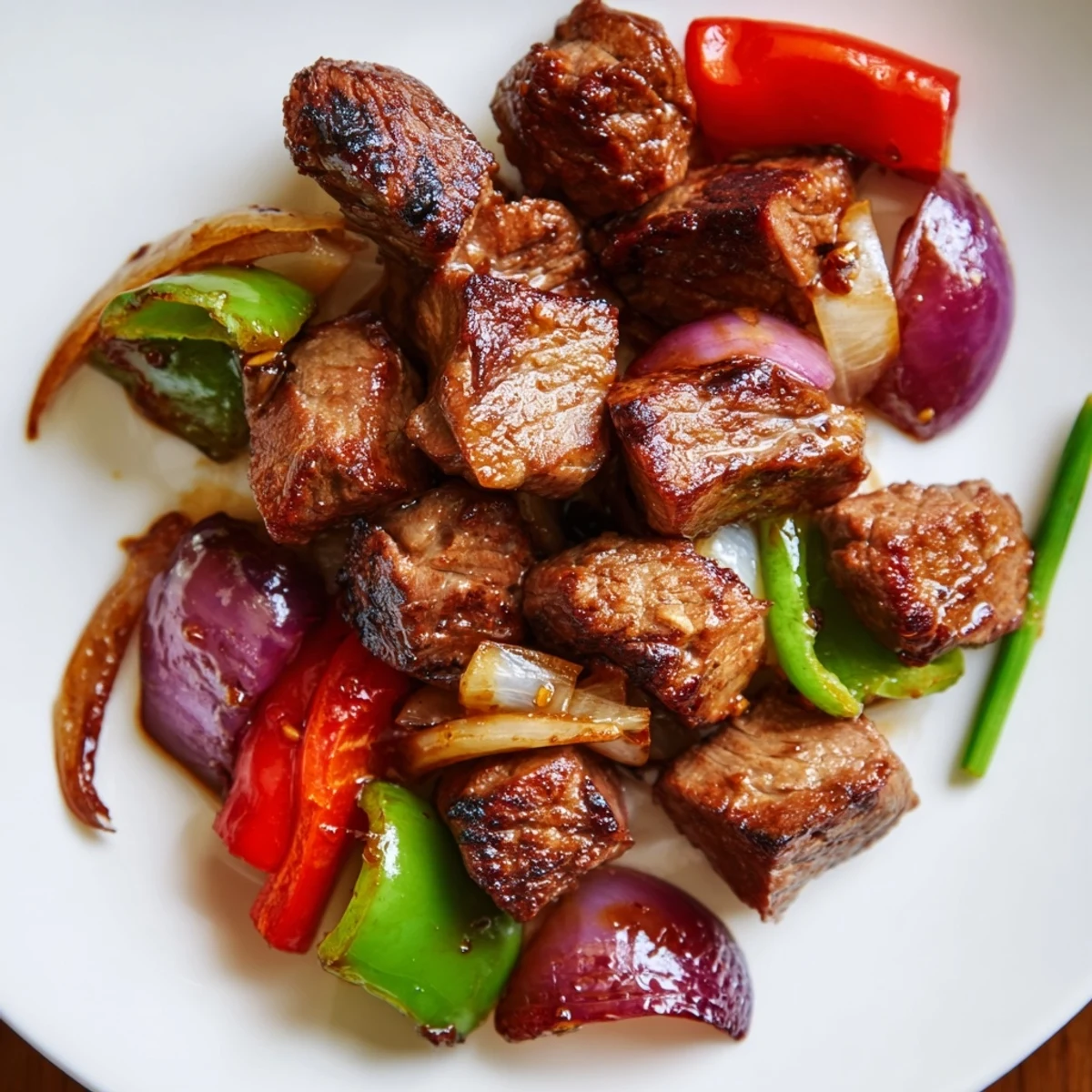 A close-up of vibrant Vietnamese Shaking Beef and crisp vegetables, ready to be enjoyed with steamed rice.