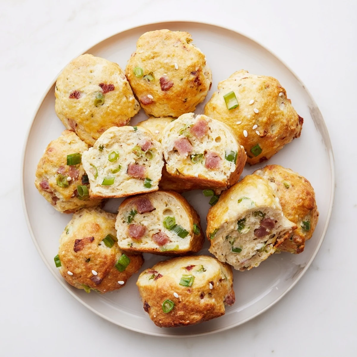 Warm homemade Chinese sausage biscuits stacked on a wire rack ready for breakfast