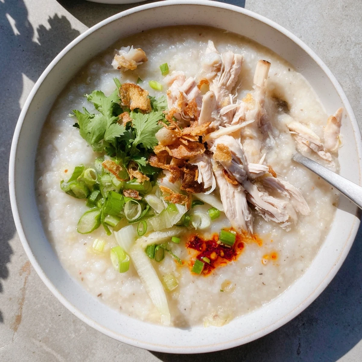 Savory rice porridge with shredded holiday turkey, ginger, and garlic simmered to silky perfection.
