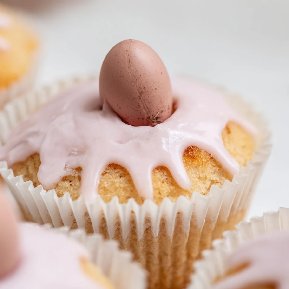 Light and fluffy sponge cakes drizzled with pastel frosting and spring themed edible sprinkles