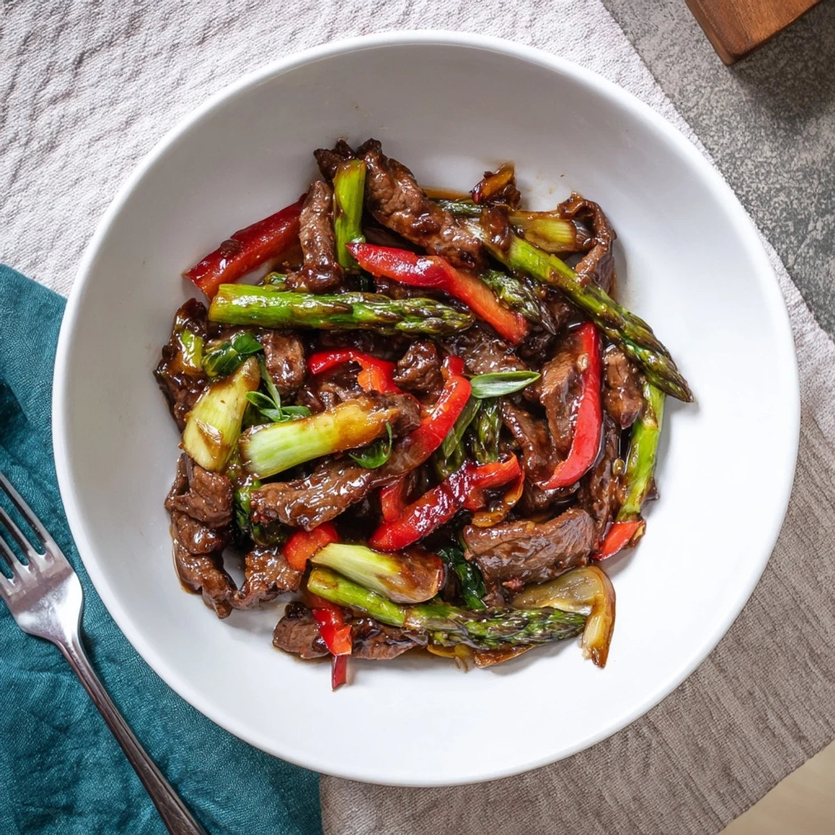 Glistening soy beef bok choy and asparagus stir fry featuring crisp vegetables and tender beef strips