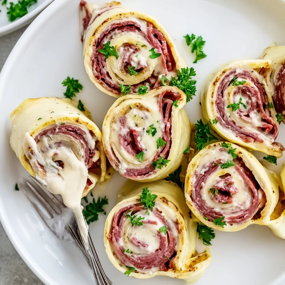 Savory corned beef and Swiss cheese tucked inside tender Low Carb Reuben Egg Roll Ups
