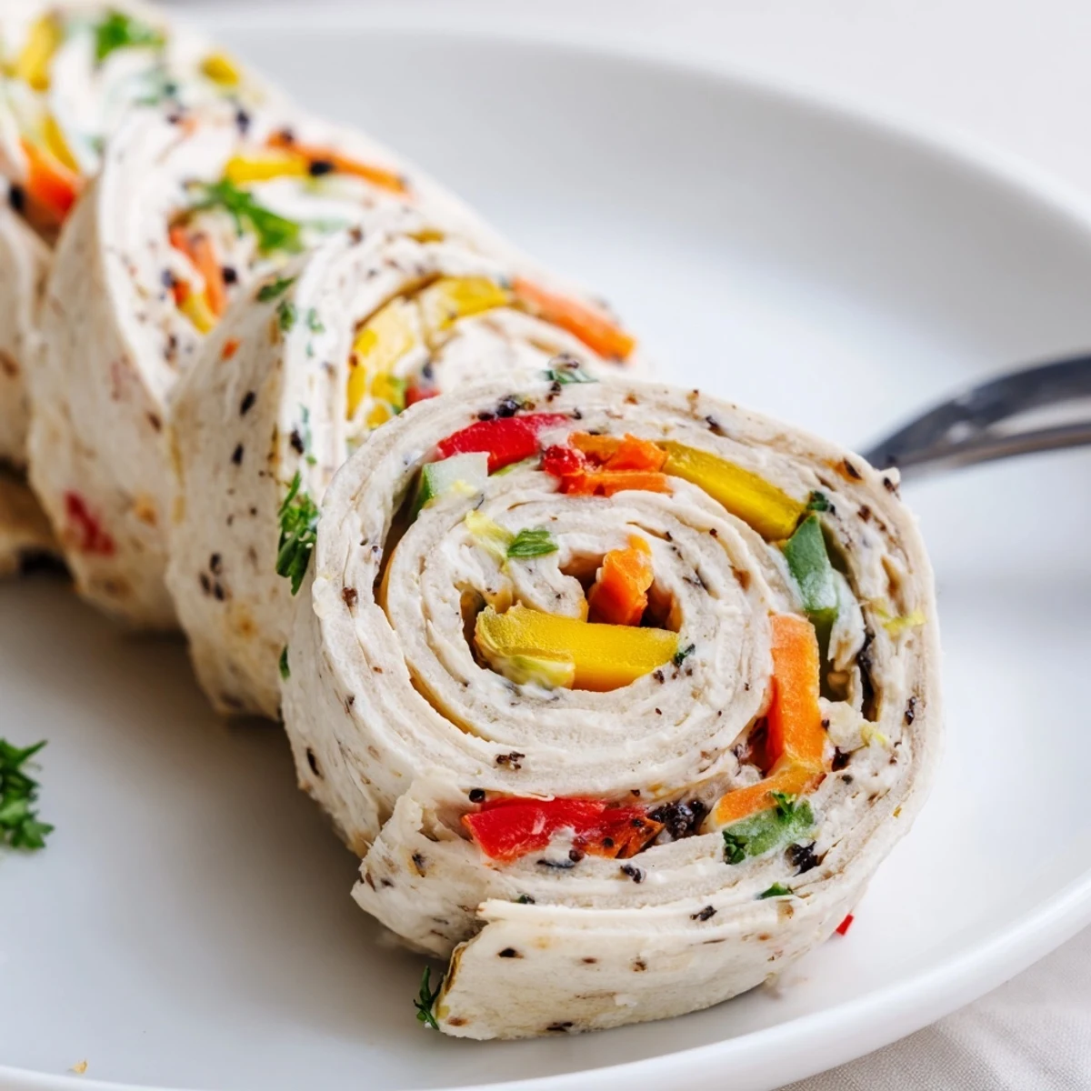 Creamy filled Vegetable Tortilla Roll Ups chilled and ready for party serving