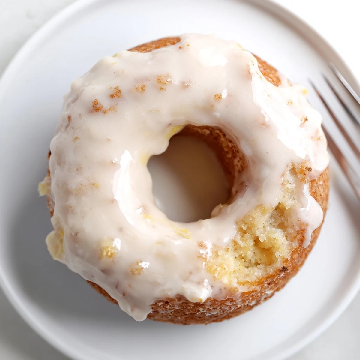 Fresh baked Banana Donuts cooling on a rack, tender cake texture