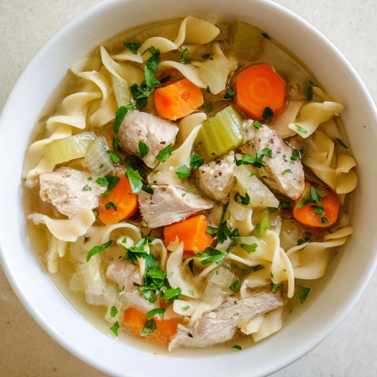 Creamy one pot chicken and noodles simmered with vegetables in savory broth