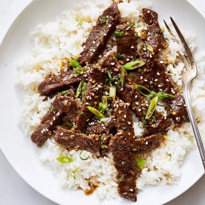 Savory-sweet Mongolian Beef Stir Fry with tender beef strips, ready to enjoy.