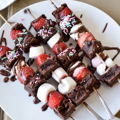 Handheld Sweet Strawberry Brownie Kabobs with fudgy squares and pillowy marshmallows