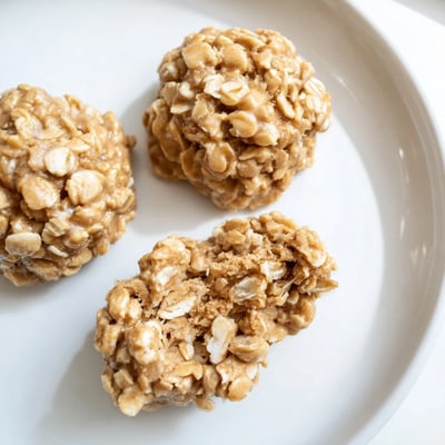 Close-up of Peanut Butter No Bake Cookies showing glossy peanut glaze, chewy  